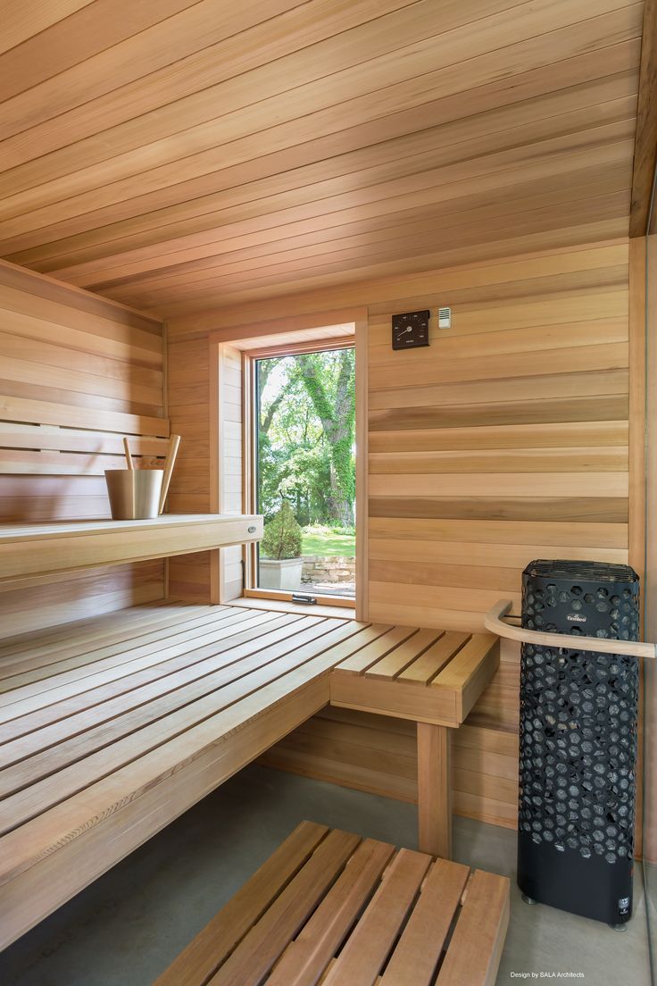 the inside of a sauna with wooden benches and shelves