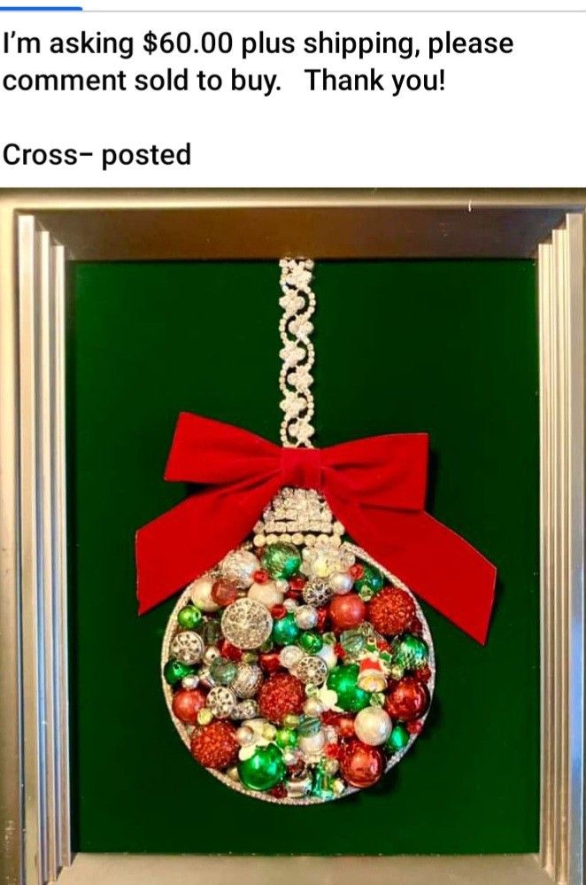 a christmas ornament hanging on a green wall