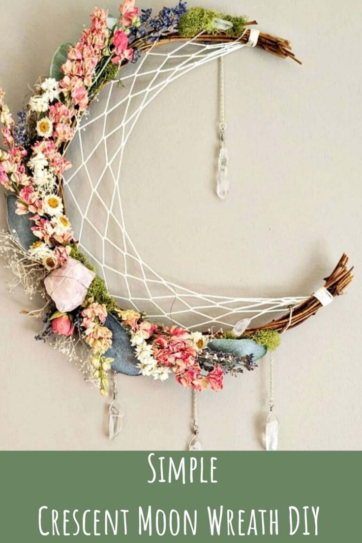 a wreath made out of flowers and branches with the words simple crescent moon wreath diy