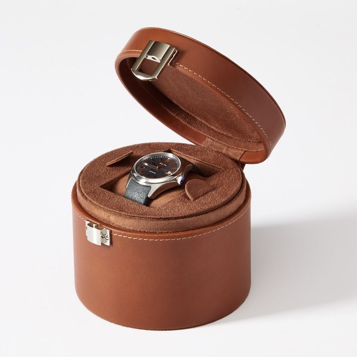 For that one spectacular timepiece that deserves its own spot, this dresser-top watch box will keep it safe and protected. The top comes out to reveal space for cufflinks or other small items. Wrapped in a durable and soft faux leather, the design is finished with a laser engraved on the lid.    5.25"w x 5"d x 4.25"h  MDF, polyurethane leather, sueded polyester interior, nickel hardware.  Clean with a soft, damp cloth.  Imported.  Monogramming is laser engraved. Watch Case For Men, Brown Rectangular Watch Case For Formal Occasions, Classic Formal Watch Accessories With Case, Brown Rectangular Case Watch Accessories For Formal Occasions, Timeless Brown Watch With Round Case, Formal Brown Watch Accessories With Rectangular Case, Modern Formal Watch Accessories With Case, Classic Formal Box Watch Accessories, Classic Formal Watch Accessories With Gift Box