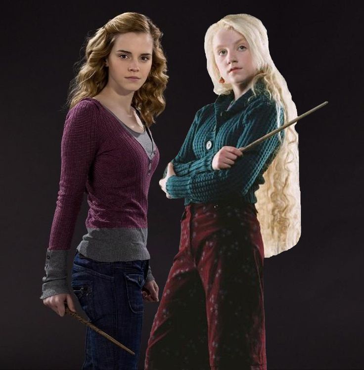 two women standing next to each other with wands in their hands and harry potter costume on