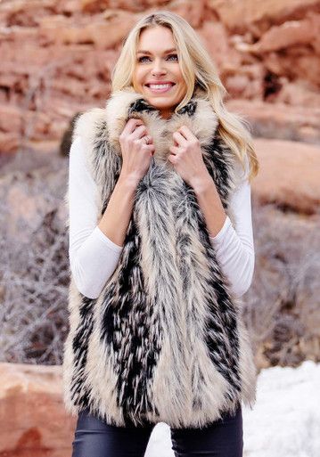 Fox, arguably nature's most beautiful fur, has an equally beautiful faux counterpart: Ivory Fox! A fur that nurtures the spirit, Ivory Fox is a trifecta of color, texture and toning, combining warm Ivory and pale Taupe with Ebony highlights and subtle tipping. A vertical pattern conveys the illusion of flattering length. Cozy velvet pockets disappear into princess seams that gently shape this body-skimming 26" classic vest. Amazing to look at, but even better to wear, you'll fall in love with the fluid, flowing hand and whisper-soft touch of Ivory Fox. Pair it with a warm turtleneck, jeans and boots for brisk fall walks; dress it up with a silk shirt and velvet pants for a romantic dinner. Finished with three hook & ring closures and with the convenience of easy-care machine wash/line dry, Fur Vest Boho, Cream Faux Fur Coat For Winter, Cream Sheepskin Fur Coat With Faux Fur Trim, Cream Fur Coat With Faux Fur Lining, Cream Faux Fur Coat With Faux Fur Lining, Beige Faux Fur Coat For Cold Weather, Mink Faux Fur Coat With Faux Fur Lining, Winter White Faux Fur Coat For Cold Weather, Fluffy Beige Faux Fur Coat