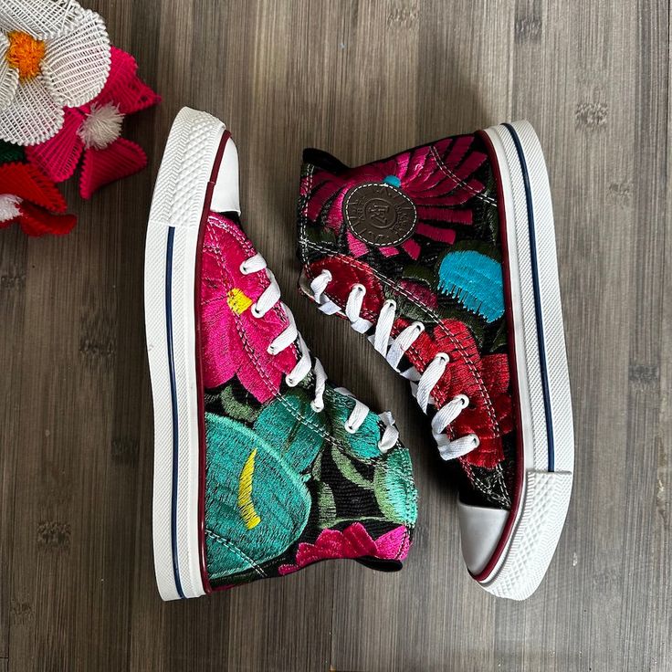 MADE IN MEXICO You will be in love with these super cute Hi Top handmade embroidered sneakers. They are lightweight and durable, with both sides featuring a unique colorful floral embroidery. Not one shoe is alike For: Women Color: Multi Details: Canvas upper is lightweight and durable. Embroidered design Lace-up closure Hi-Top Medial eyelets enhance airflow Waffle rubber sole FOR MORE DETAILS PLEASE CONTACT US. PLEASE READ BEFORE PURCHASE: The picture is an ACCURATE REPRESENTATION.Colors in the Casual High-top Custom Sneakers With Embroidered Logo, Multicolor Low-top Sneakers With Embroidered Logo, Casual Multicolor Sneakers With Embroidered Logo, Spring Sneakers With Multicolor Embroidery And Appliques, Casual Custom Sneakers With Embroidered Logo, Summer Embroidered High-top Sneakers, High-top Multicolor Embroidered Sneakers, High-top Embroidered Multicolor Sneakers, Multicolor Embroidered Sneakers For Summer