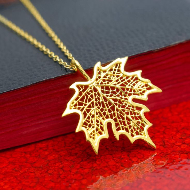 Gold Maple Leaf Necklace, 24k Gold Vermeil Style Leaf Pendant & Gold Filled Chain, Botanical Tree Leaf Jewelry, Filigree Leaf, Autumn Gift, FREE SHIPPING Add a touch of nature to your look with this elegant and detailed 24 karat gold Vermeil style maple leaf pendant necklace. The gold maple leaf can be matched with your choice of 14 karat gold filled chain. What is Vermeil Style? Gold vermeil jewelry refers to gold plated over 925 sterling silver. To be considered Vermeil the gold layer must be Gold Plated Leaf-shaped Jewelry, Gold Leaf-shaped Jewelry Gift, Nature-inspired Gold Leaf Necklace, Leaf-shaped Yellow Gold Plated Jewelry, Leaf-shaped Yellow Gold Necklace, Leaf-shaped Yellow Gold Necklace For Gift, Yellow Gold Leaf-shaped Jewelry Gift, Gold Plated Leaf-shaped Jewelry For Gifts, Yellow Gold Plated Leaf-shaped Jewelry