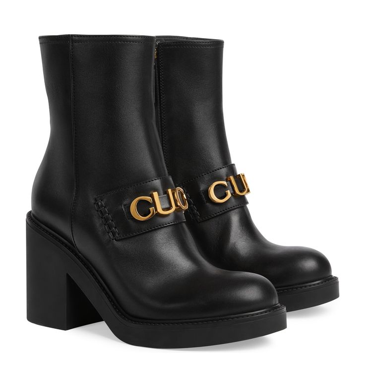 The Women's Gucci Boot is a striking and modern ankle boot that exudes contemporary flair. Crafted from sleek black leather, this boot features a bold Gucci script logo detail across the front, adding a touch of luxury and brand recognition. The lug rubber sole provides both style and functionality, offering traction and durability for everyday wear. With its side zip closure, slipping into these boots is effortless, while the casual yet chic design makes them versatile for a range of occasions. Whether paired with jeans and a sweater for a casual day out or dressed up with a skirt and blouse for a more polished look, the Women's Gucci Boot adds a statement finish to any ensemble with its bold logo and stylish silhouette. Gucci Boot, Leather High Heel Boots, Bold Logo, Chelsea Boots Women, Black Boots Women, Leather High Heels, Black Leather Heels, Motorcycle Boots, Womens Ankle Boots