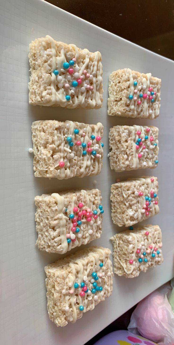 six pieces of rice krispy treats on a white plate