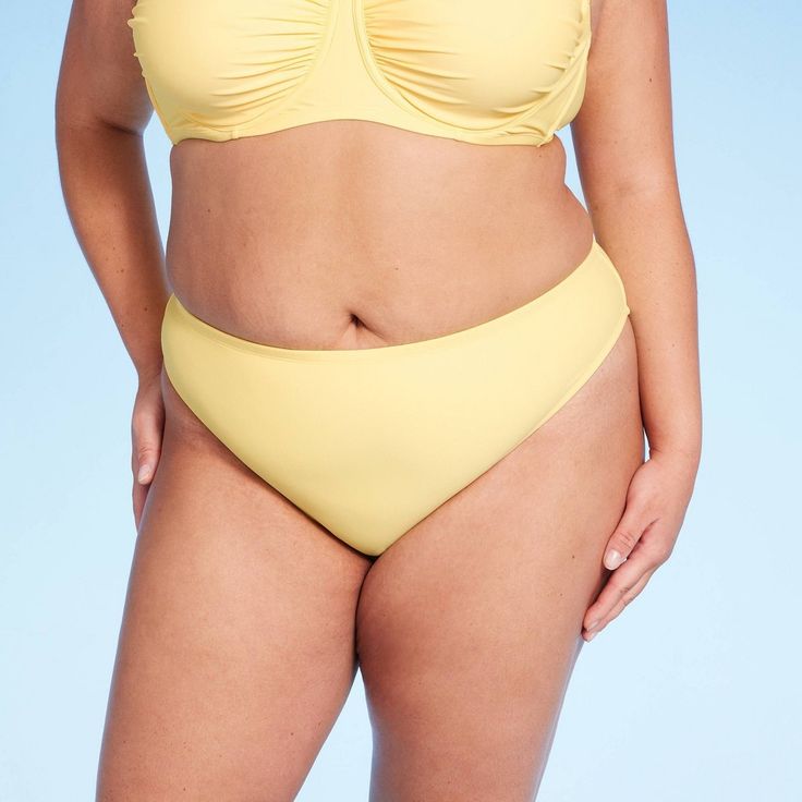 Mid-rise cheeky bikini bottom from Wild Fable™ in yellow. Made from soft fabric with spandex and full lining for stretchy comfort in and out of the water. Designed with high leg and opaque sheerness. If you're not satisfied with any Target Owned Brand item, return it within one year with a receipt for an exchange or a refund. Wild Fable™: A look for every story. Yellow Brief Swimwear For Vacation, Yellow Swimwear Briefs For Beach, Yellow Swimwear Brief For Beach Season, Yellow Brief Swimwear For Beach Season, Yellow Brief Swimwear For Swimming, Yellow Seamless Beachwear Bottoms, Yellow Brief Bottoms For Pool, Yellow Stretch Seamless Swimwear, Yellow Seamless Stretch Swimwear