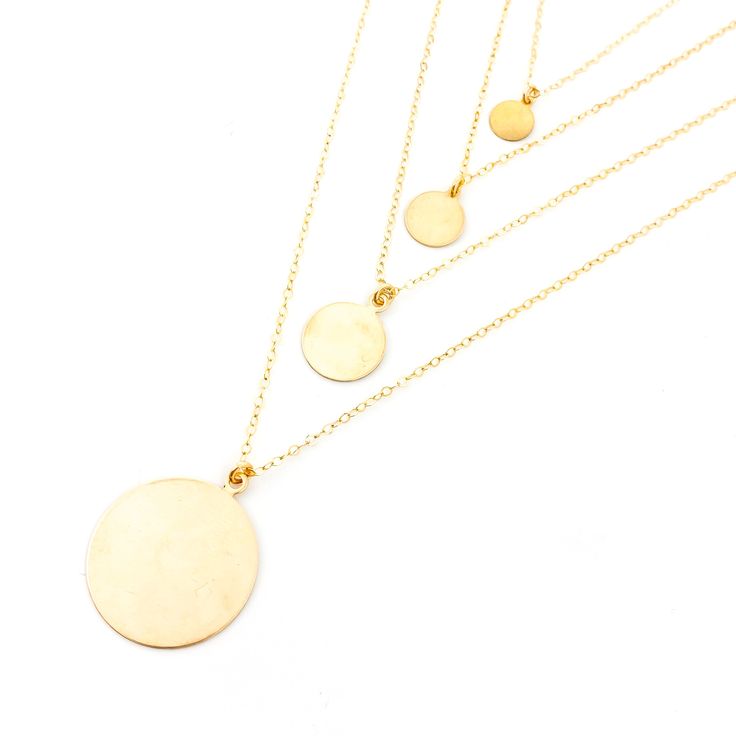 Expertly crafted by our team, the Elena Disc Necklaces in gold or silver feature 14k gold-filled or sterling silver chain and blank disk charms. Customize with hand stamping, adding initials, words, or dates for a personal touch. Contact us for stamping options and prices. Elevate any outfit with this timeless and unique piece. 7mm disc: 16" chain 9.5mm disc: 18" chain 13mm disc: 18" chain 22mm disc: 18" chain Flat Heel Boots, Cut Clothes, Beanie Style, Gold Charm Necklace, Sneaker Slippers, Heel Slippers, Charm Necklaces, Disc Necklace, Necklace Sizes