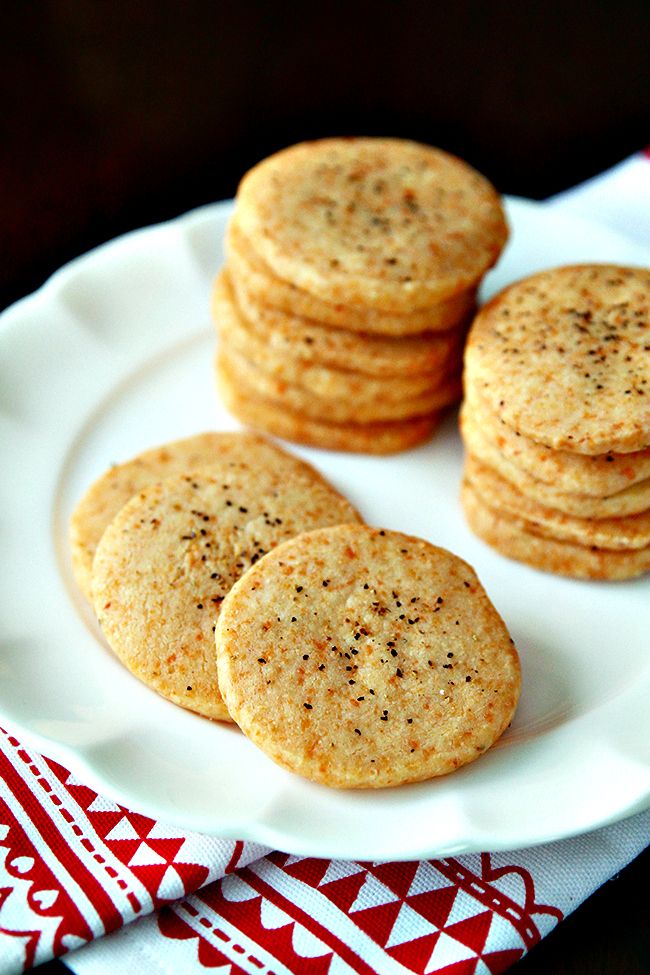 some cookies are on a white plate with a red and white napkin next to it