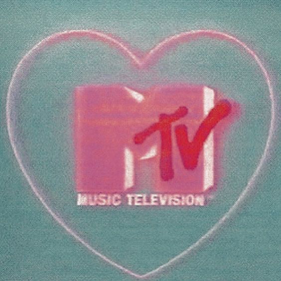 a pink heart with the word music television in it's center and an x on top