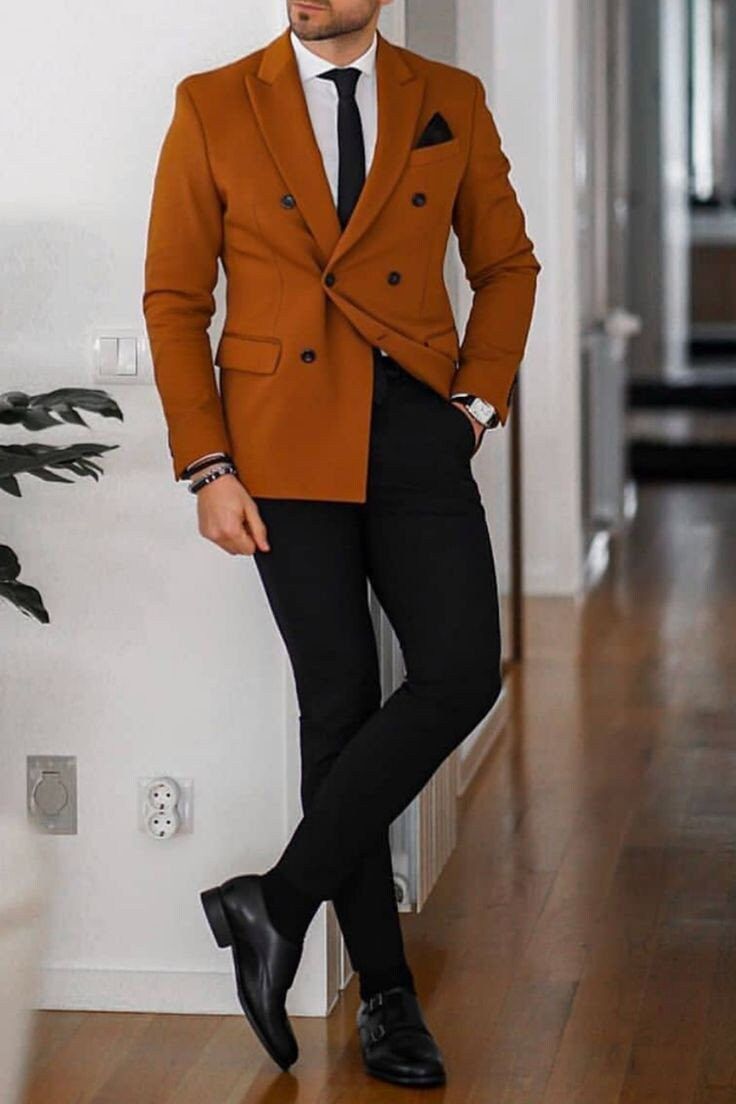 This beautiful jacket and pant trouser is designed with high quality wool material that guarantees durability and comfort. It is suitable for all kinds of occasion and it can be worn all year round. It comes in 2 pieces (burnt orange color Jacket + Black pant), the jacket can also be worn with any pant/jeans. For custom orders, Please feel free to start a  conversation for further enquires. Your satisfaction is our priority  I hope you have a pleasurable shopping experience Burnt Orange Mens Wedding Attire, Black And Orange Suit Men, Burnt Orange Men Outfit, Burnt Orange Trousers Outfit, Orange Notch Lapel Blazer For Work, Brown Long Sleeve Office Suits, Brown Double-breasted Blazer For Semi-formal Occasions, Brown Double Breasted Suit For Formal Occasions In Fall, Tailored Orange Blazer With Notch Lapel