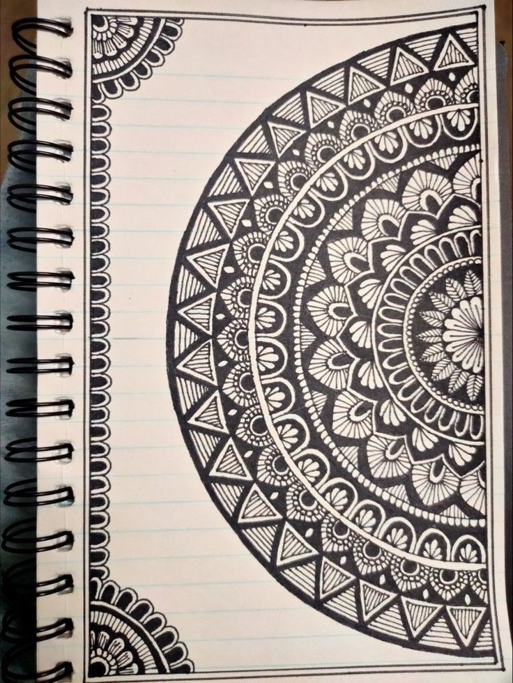 a notebook with an intricate design on it