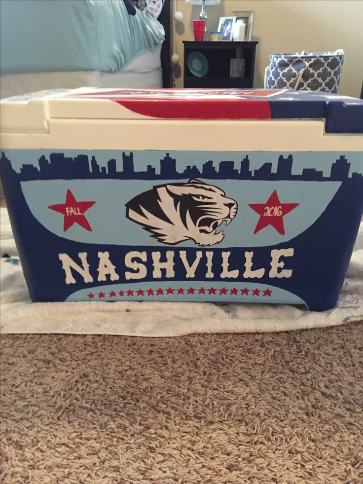 an ice chest with the word nashville painted on it and red white and blue stars