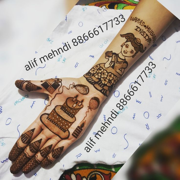 a woman's hand with hendi tattoos on it