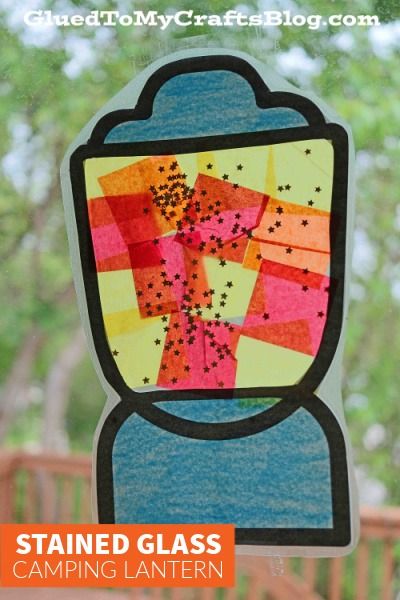 the stained glass camping lantern is made with construction paper and colored crayons on it