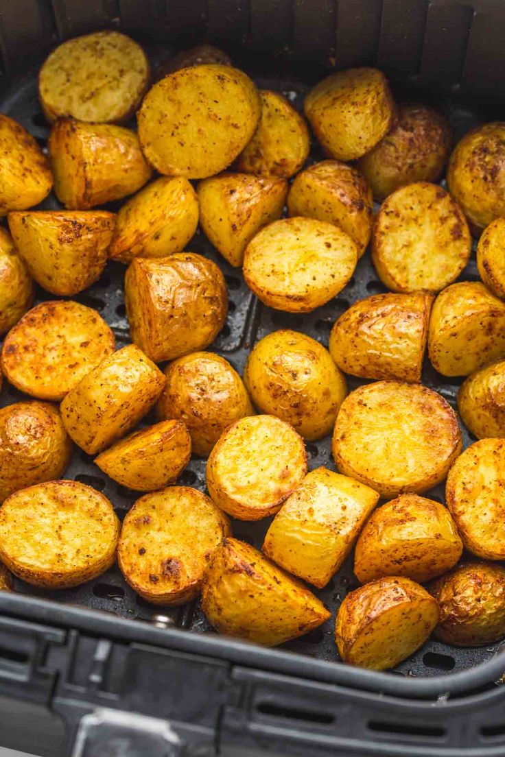 cooked potatoes in an air fryer basket