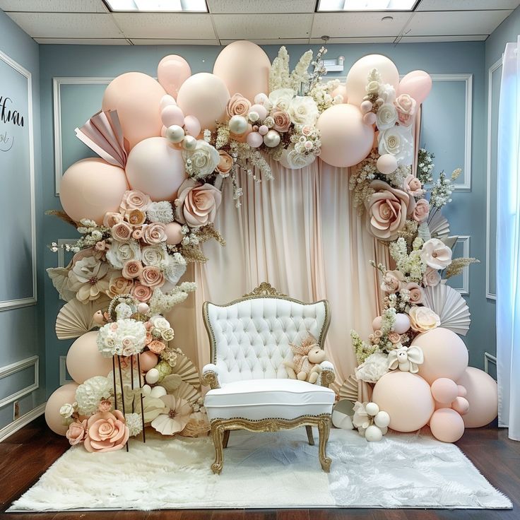 a room decorated with balloons and flowers