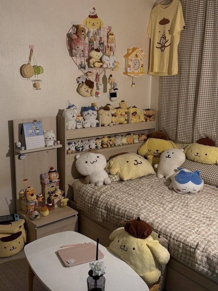 there are many stuffed animals sitting on the bed in this child's room,