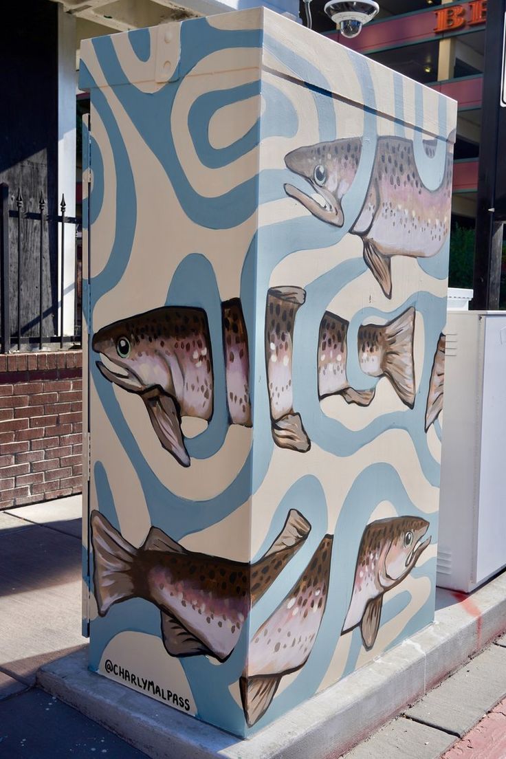 a box with fish painted on the side of it