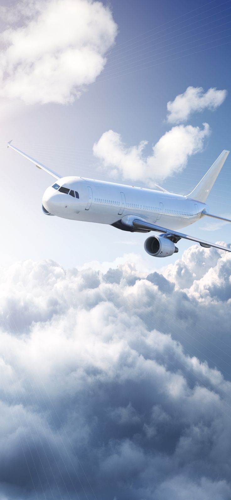 an airplane flying in the sky above clouds