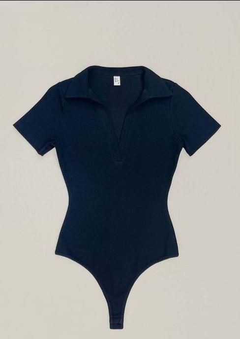 Knit ribbed short sleeve collard polo bodysuit, with snap button closure Material: 97% Cotton 3% Spandex Bodysuits Outfit, Jazz Dance Outfits, Polo Bodysuit, Cute Bodysuits, Bodysuit Shirt, Bodysuit Tops, Best Friend Outfits, Body Suit Outfits, Ribbed Shorts