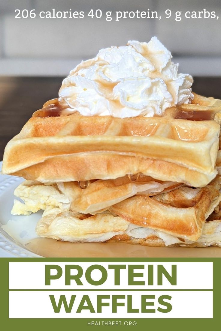 a stack of waffles with whipped cream on top and the words protein waffles