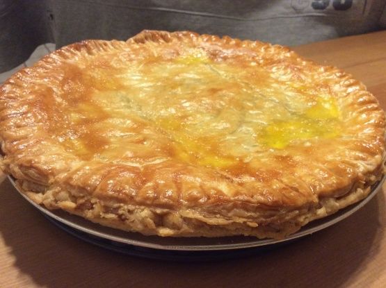 a pie sitting on top of a wooden table