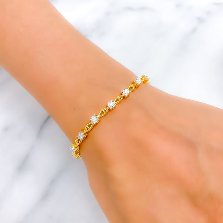 This timeless 18k gold bracelet, weighing 10.9 grams, features a classic design adorned with 0.52 carats of round brilliant cut diamonds. The diamonds have a color grade of F-G and a quality grade of VS, adding exceptional sparkle and elegance. The yellow gold finish enhances its luxurious appeal, making it perfect for any special occasion. The bracelet has a size of 7 inches, offering both style and comfort. This piece is openable, designed with a push snap lock and clasps for added convenience Dainty Diamond Tennis Bracelet With Brilliant Cut, Dainty Diamond White Diamond Tennis Bracelet, Timeless White Cubic Zirconia Diamond Bracelet, Dainty Yellow Gold Cubic Zirconia Tennis Bracelet, White Diamond Bracelet For Everyday Luxury, White Diamond Chain Bracelet In Fine Jewelry Style, White Cubic Zirconia Gold Bracelet With Jubilee Design, White Dainty Diamond Bracelet For Formal Occasions, Dainty White Diamond Bracelet For Formal Occasions