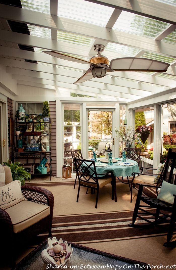 the sun room is clean and ready for guests to use it as an outdoor dining area