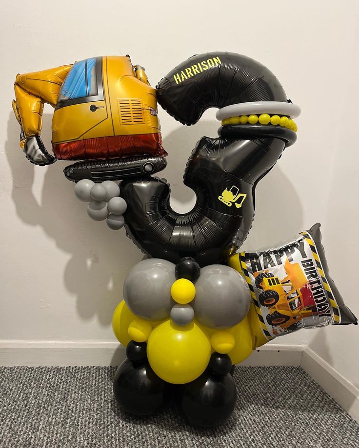 some balloons that are in the shape of an octopus and other things on top of it