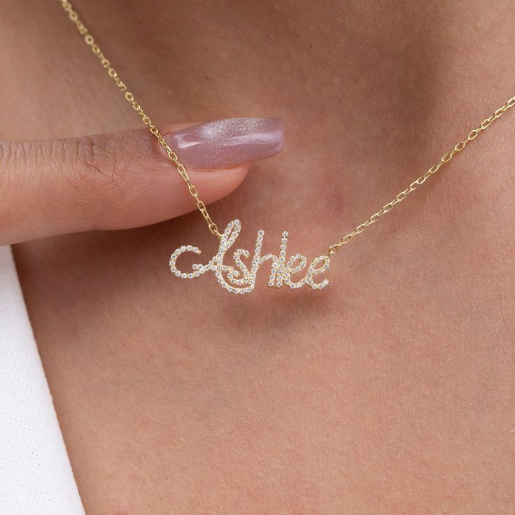 "This 14k personalized diamond name necklace is the perfect gift for the bridal party, someone special, or yourself.  How to order 1- Pick the fonts you like and send us a message 2- We will send you a picture of your name with the fonts you chose 3- If you like it any of them, place your order. 4- We send a final 3d mock up for approval. 5- Once approved we go ahead and finish your necklace. M A T E R I A L & L E N G T H Available in 14k Yellow Gold, 14k Rose Gold, 14k White Gold, Sterling Silver Stone: Natural Diamonds Thickness: 1.3mm / 0.05\" Initials Lowercase: 4-6 mm (Depending on the font) Capital: 9-12 mm (Depending on the font) Diamond weight: 0.15 ct. - 0.70 ct. depending on the name Chain Length:  14+2, 16+2 options or any length up to 20 inches without extension. (Please leave Elegant Customizable Necklace For Anniversary Gift, Elegant Customizable Necklace For Anniversary, Elegant Custom Name Necklace For Anniversary, Elegant Personalized Name Necklace For Anniversary, Elegant Personalized Necklace For Anniversary Gift, Personalized White Diamond Necklace, Elegant Personalized White Diamond Necklace, Customized Signature Necklace For Anniversary, White Diamond Name Necklace As Gift