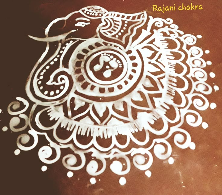 an intricately designed piece of paper on a table with the words ragi chakra written in it