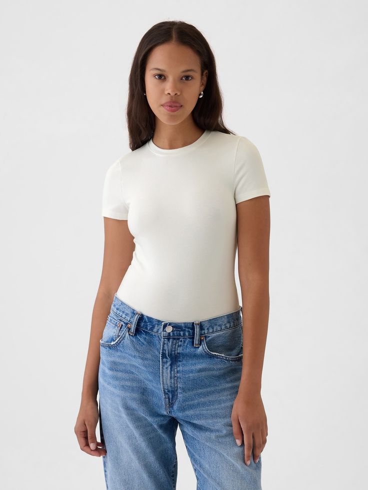 Soft, stretchy cotton-modal blend T-shirt bodysuit.  Crewneck.  Short sleeves.  Snaps at inseam.  Full coverage back.  * Fit: Slightly fitted.  Sits close to the body.  Models wearing Gap White Fitted Shirt Outfit, Shirt Bodysuit, Body Suit Outfits, Body Suit, Family Pictures, Shirt Outfit, White Shirt, Workout Shirts, Gap