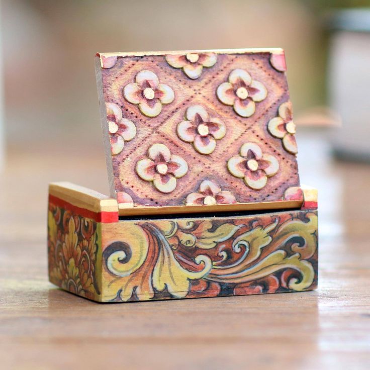 Floral motifs swirl gracefully along the sides and lid of this lovely decorative box. Artisan Gung Gus of Indonesia meticulously hand-paints the crocodile wood box lining it with black velvet. Small Jewelry Box Painting Ideas, Hand Carved Jewelry Boxes, Wood Burned Jewelry Box Design, Painted Jewlrey Boxes, Trinket Boxes Wooden Painted, Box Makeover, Mini Jewelry, Jewelry Box Makeover, Box Branding