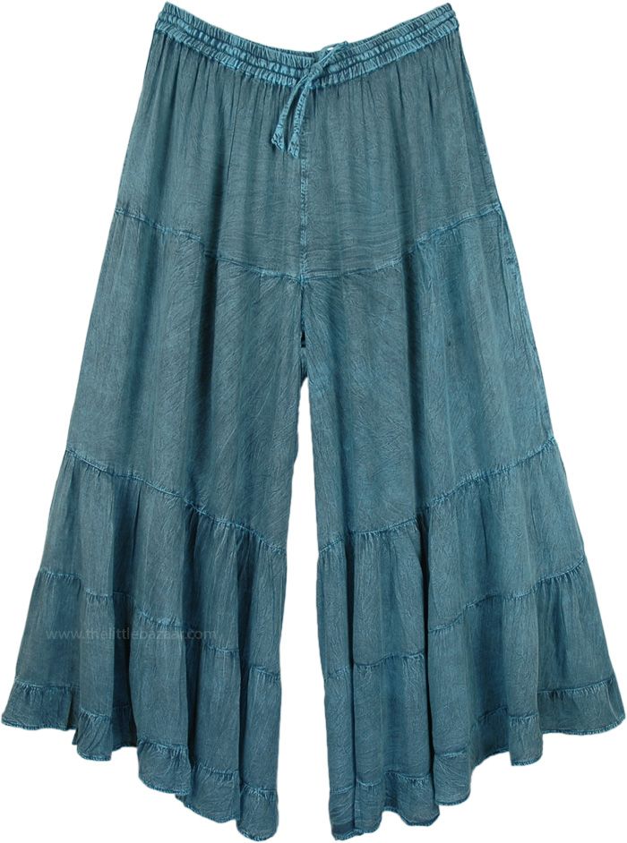 A relaxed pair of long dull stonewashed teal palazzo pants for the summer season. The huge flare gives it a feminine yet cool bohemian look, almost looks like a skirt with divided legs. You can mix and match the styles and wear them with tops of different colors. It has an elastic waistband and drawstrings for extra comfort. These casual summer day pants will go with every style and fashion. You can wear them with flats or heels. You can wear jewelry and accessorize yourself. The fabric is light Indigo Full Length Bottoms For Summer, Denim Blue Bohemian Relaxed Fit Pants, Bohemian Style Relaxed Fit Denim Blue Pants, Indigo Washed Bottoms For Spring, Indigo Bohemian Relaxed Fit Bottoms, Indigo Cotton Pants For Summer, Summer Indigo Cotton Pants, Bohemian Denim Blue Cotton Pants, Bohemian Style Denim Blue Cotton Pants