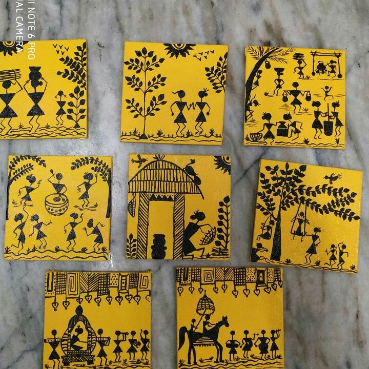 six yellow coasters with black designs on them sitting on a marble counter top next to each other