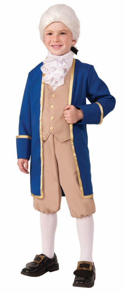 a young boy dressed in an american colonial era costume, standing with his hands on his hips