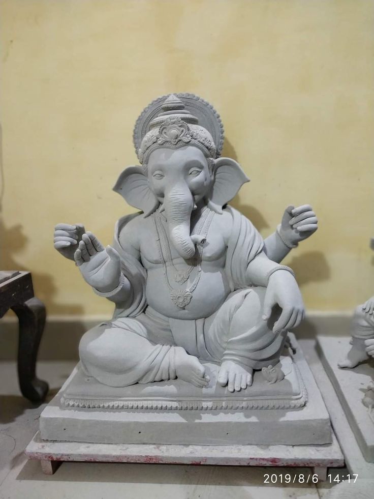 an elephant statue sitting on top of a table