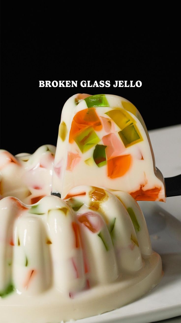 there is a cake that has been made with broken glass jello on the plate