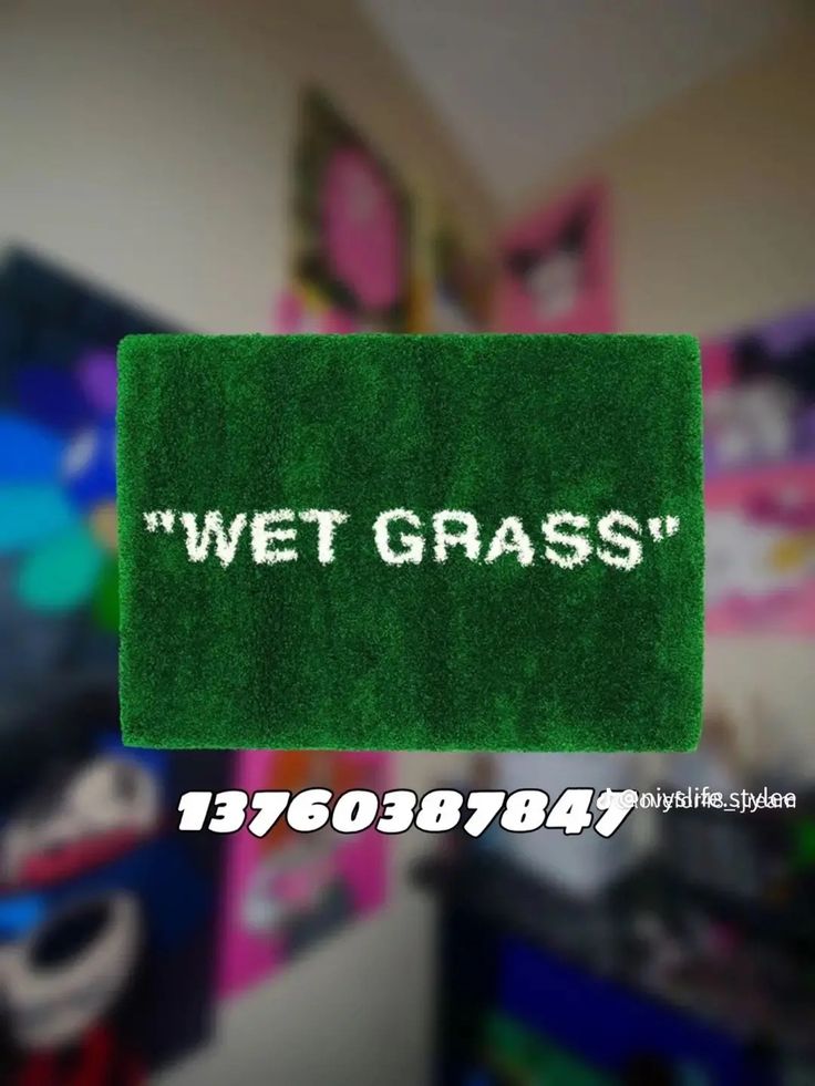 the words wet grass written in white on a green area rug