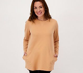 Sporty and stylish, this laid-back tunic from Denim & Co.(R) Fashions dresses up your down time. A cute, feminine take on your typical off-duty duds, it features side pockets and a subtle hi-low hemline for flattering coverage. Best of all, it's offered in customer-favorite French terry fabric for a cozy, comfy feel that fits right in with your ath-leisure wear.  It's made for the weekend warrior. From hitting the sale rack to walking the dog, this tunic lets you tackle your to-do list in comfor Curved Hem Tops For Daywear In Spring, Casual Tops With Curved Hem For Daywear, Casual Fall Tunic For Loungewear, Casual Tunic For Fall Layering, Casual Fall Loungewear Tunic, Casual Cotton Tunic For Layering, Fall Cotton Tunic For Loungewear, Fall Daywear Tunic With Shirttail Hem, Spring Crew Neck Relaxed Fit Tunic