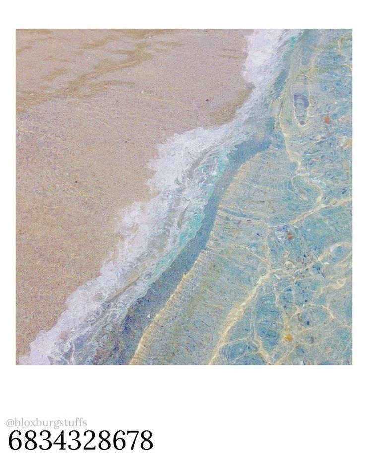 an image of the beach with waves coming in from the water and sand on it