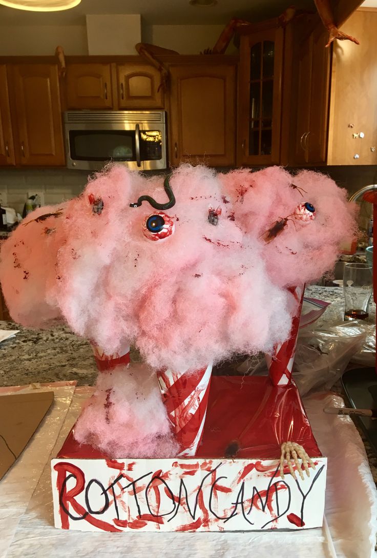 an elephant made out of cotton candy sitting on top of a table in a kitchen