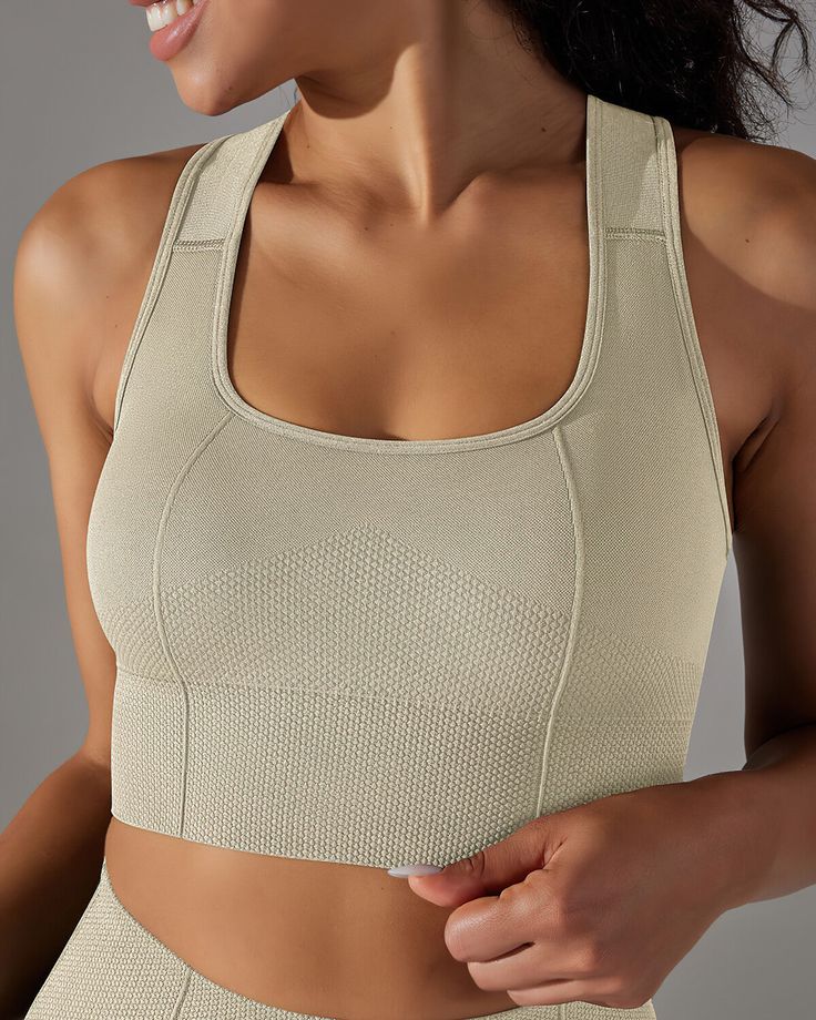 The Alodia Racerback Sports Bra, a beacon of style and strength, embodies the perfect fusion of form and function for the modern athlete. Crafted from premium knitted fabric, this sports bra envelops you in luxurious comfort and a soft, second-skin embrace that keeps you poised for peak performance, whether you're conquering the gym or embracing an active day ahead.With its sleek U-shaped neckline and racerback design, the Alodia Racerback Sports Bra not only delivers a fashion-forward look but also offers unparalleled support. Precision-contoured seams and panels ensure a flawless fit, guaranteeing it stays firmly in place during even your most demanding workouts. And thanks to its moisture-wicking and breathable technology, you'll stay cool, dry, and ready to take on any challenge with u Racerback Sports Bra, Peak Performance, Second Skin, The Gym, Moisture Wicking, Best Sellers, Fashion Forward, Knitted Fabric, Sports Bra