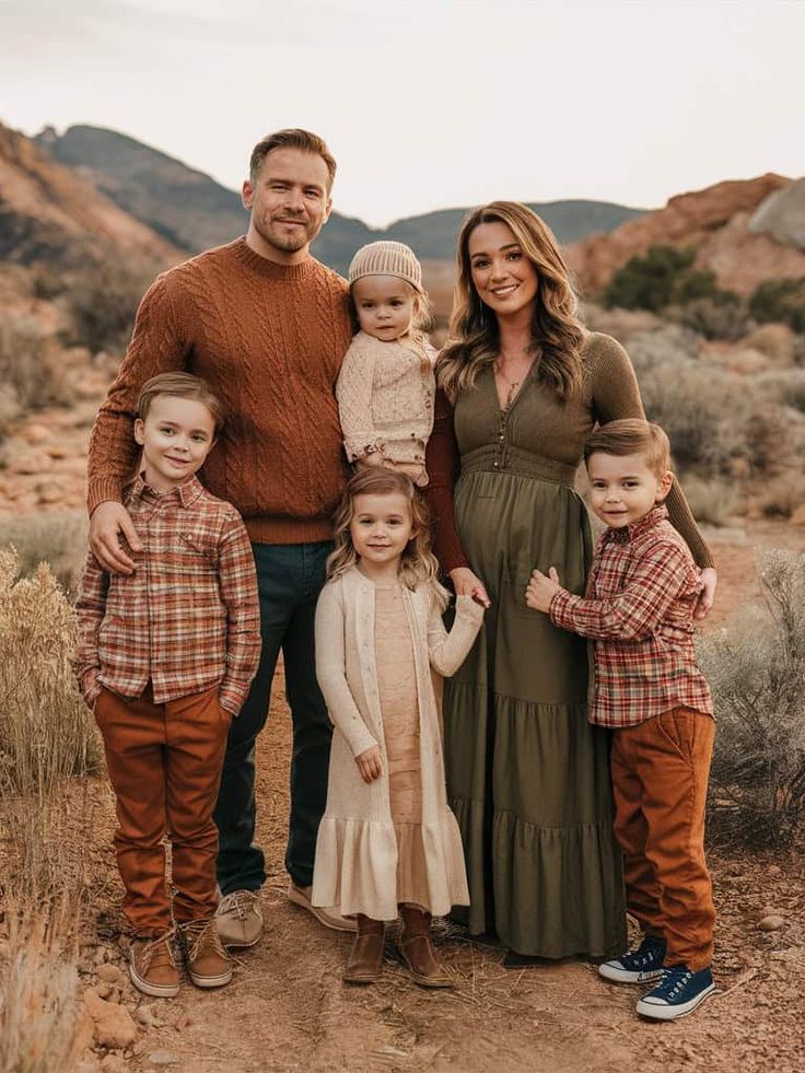 a family posing for a photo in the desert