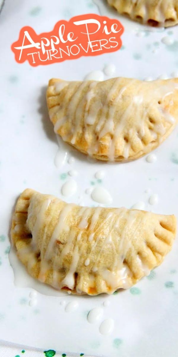 three apple pie turnovers sitting on top of a white plate