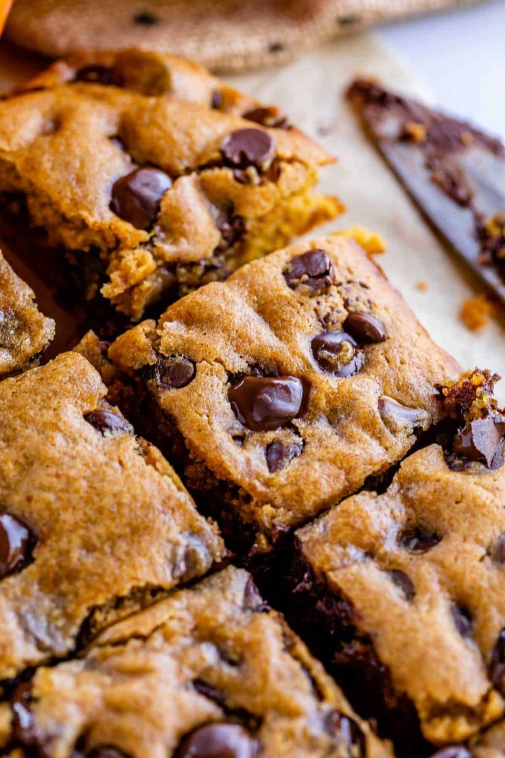 chocolate chip cookie bars cut into squares on a cutting board