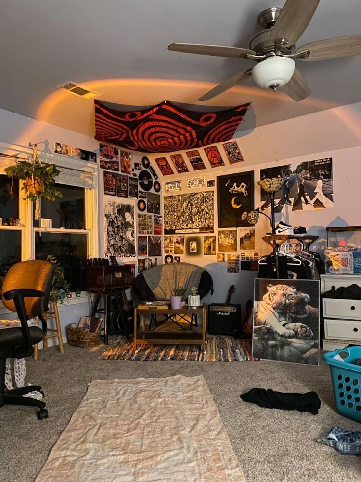 a living room filled with lots of clutter and furniture next to a ceiling fan