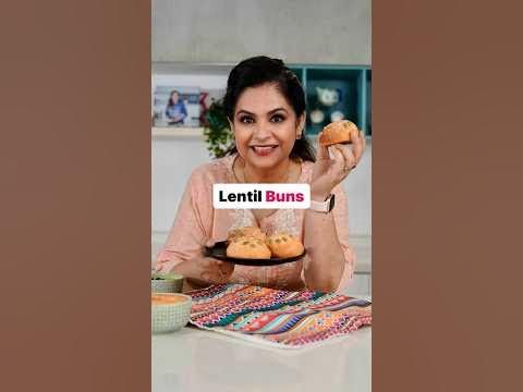 a woman sitting at a table with some food in front of her and the words lentti buns on it