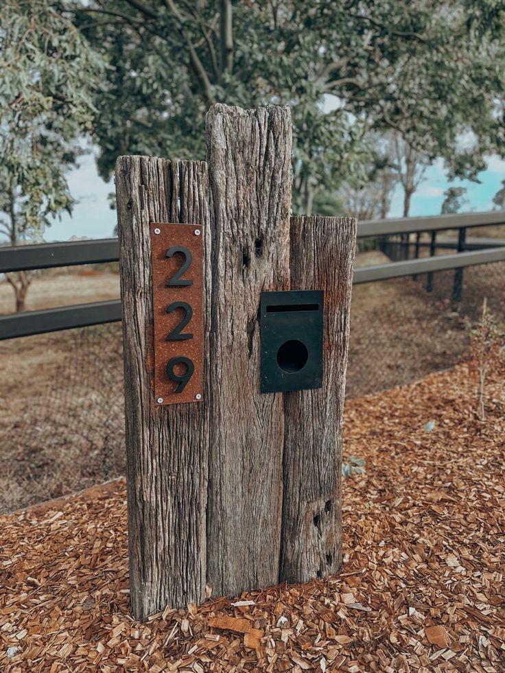 a wooden post with a sign that says 2012 on it